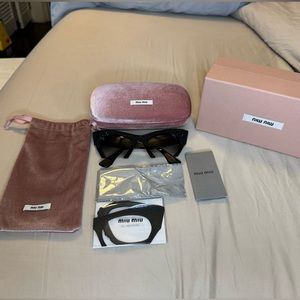 Miu Miu Rasoir Rock Collection Black gemstone cateye sunglasses.